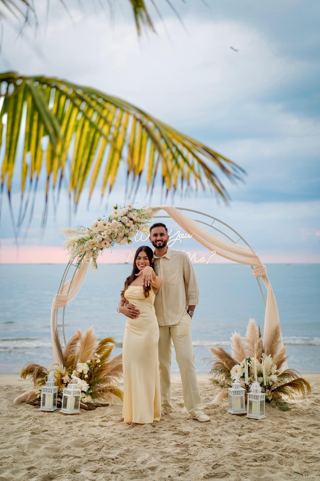 Kishen and Haswin under the proposal arch